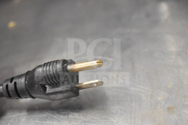 Electric plug of Biro Sir Steak countertop meat tenderizer, 115 volts, 1 phase, on a stainless steel surface.