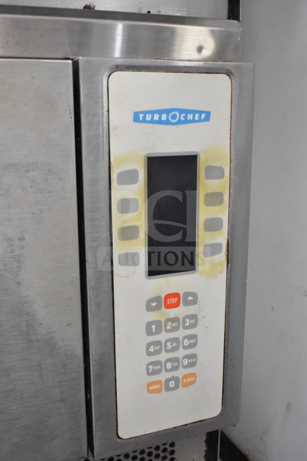 Turbochef NGC commercial electric rapid cook oven control panel, visible wear on keypad, vented stainless steel exterior.