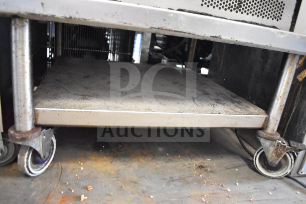 2 Turbochef NGC commercial rapid cook ovens on equipment stand, 208/240V, 1 phase, visible wear, caster wheels.