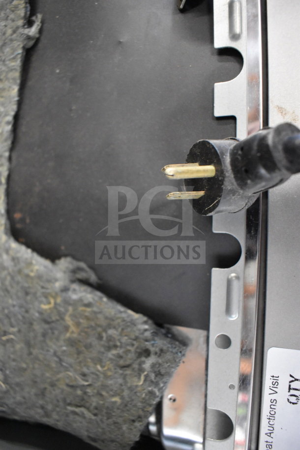 Alto Shaam 750-S commercial heated holding cabinet plug and exterior detail, showing metal casing and insulation.