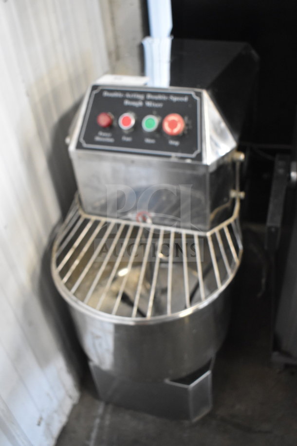 Commercial floor-style spiral dough mixer with mixing bowl, bowl guard, and dough hook. Control panel visible.