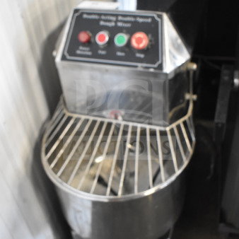 Commercial floor-style spiral dough mixer with mixing bowl, bowl guard, and dough hook. Control panel visible.
