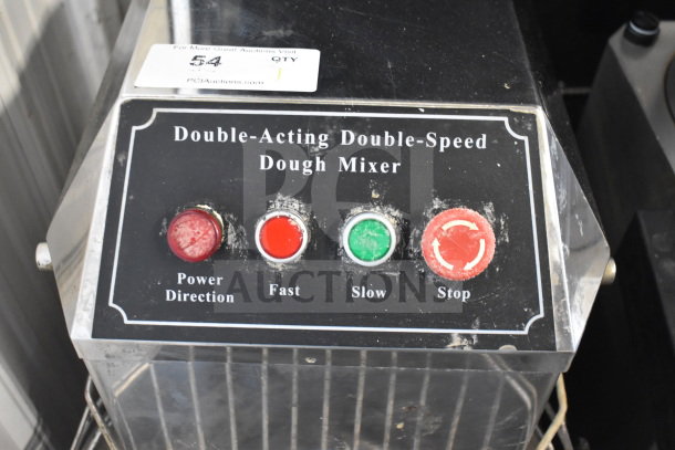 Commercial floor-style spiral dough mixer control panel with buttons for power, fast, slow, and stop functions.