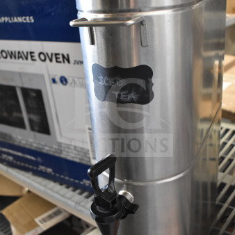 Grindmaster 6700-30000 beverage dispenser, stainless steel, labeled "Iced Tea," in good condition with spigot and handles.