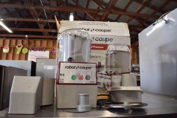 Robot Coupe R2 commercial countertop food processor with blades, box included, in used condition.