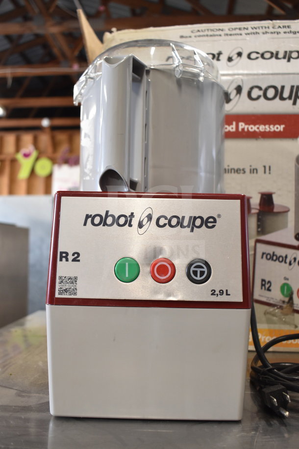 Robot Coupe R2 commercial countertop food processor with control panel, blades, and 2.9L capacity, in excellent condition.