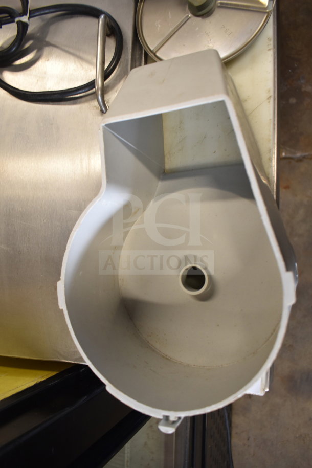 Robot Coupe R2 commercial countertop food processor, visible blades, stainless steel base, minor wear shown.