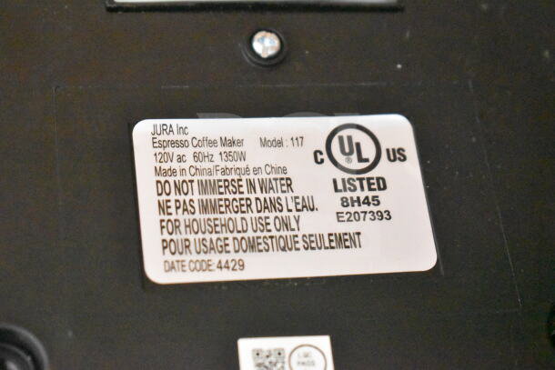 Jura 117 Capresso espresso machine label showing model 117, 120V, 1350W, made in China, for household use only.