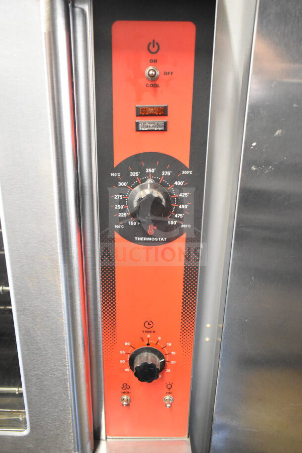 Vulcan commercial convection oven with view-through doors, thermostatic controls, and metal legs. Temperature dial visible.