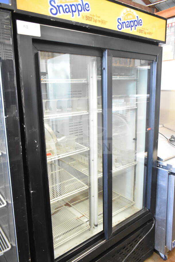 Universal Nolin MC1100S-1 commercial 2 door reach-in cooler merchandiser, 115 volts, 1 phase, Snapple branding on top.