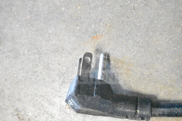 Close-up of a power plug for the 2020 MCF8724GR Commercial 3 Door Reach In Cooler, 115 Volts, 1 Phase.