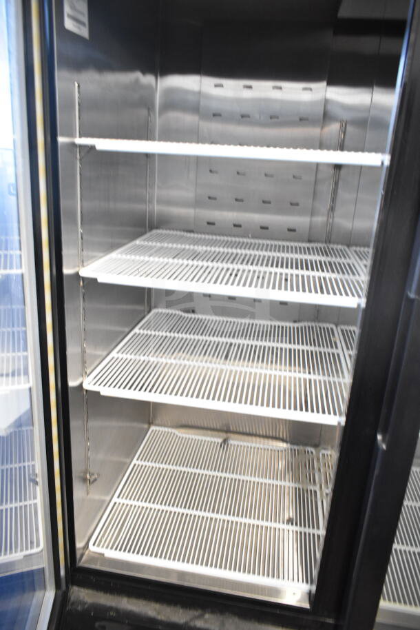 2020 MCF8724GR Commercial 3 Door Reach-In Cooler Merchandiser, 115V, 1 Phase, with adjustable shelves, excellent condition.