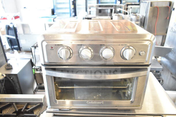 Cuisinart TOA-60 countertop toaster oven air fryer, silver finish, four control knobs, visible branding, clean condition.