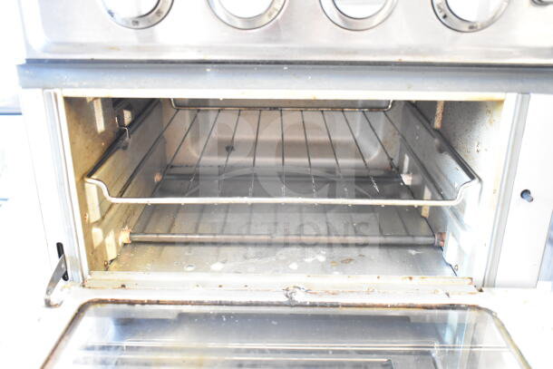 Cuisinart TOA-60 Countertop Toaster Oven Air Fryer, 120V, open door view, shows interior racks, light wear.