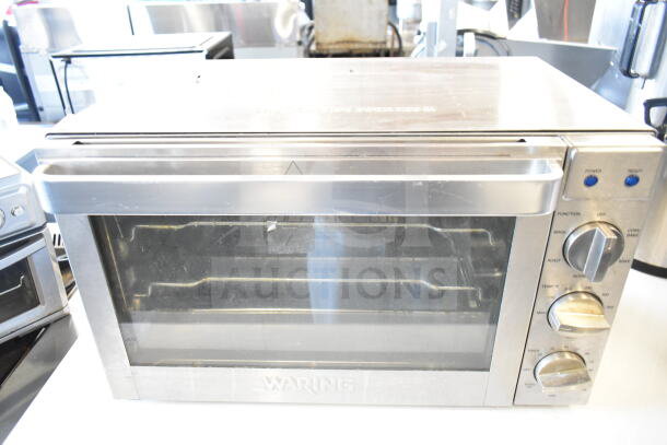 Waring Countertop Toaster Oven Air Fryer, 120V, 1 Phase, stainless steel, multiple functions, visible dials and indicators.