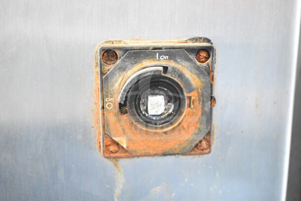 Talsa K50 meat chopper power switch, displaying rust and wear. Clearly marked on/off settings, indicating usage.