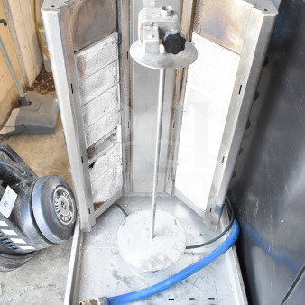 DG16V countertop gyro machine, natural gas powered, vertical rotisserie, good condition, visible blue hose, metal frame.