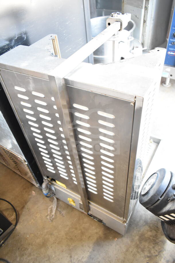 DG16V countertop natural gas gyro machine with stainless steel body. Model DG16V, appears in used condition.