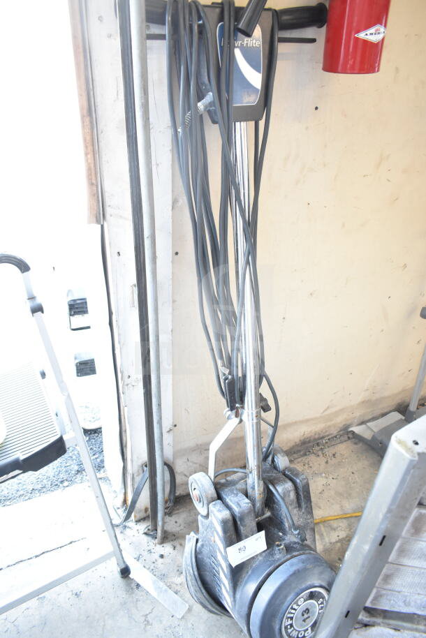 Powr-Flite P131-3 floor cleaning machine, used condition, visible wear, attached power cord, ideal for commercial cleaning.