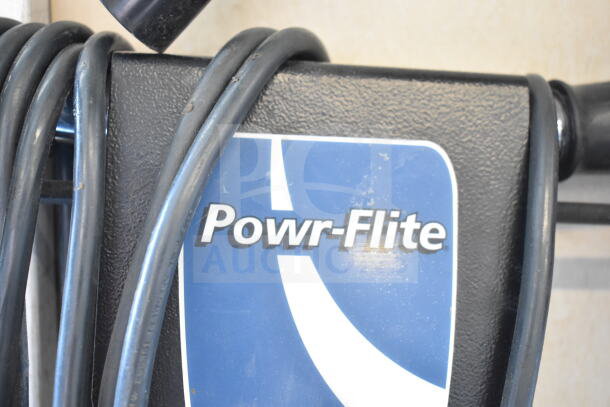 Powr-Flite P131-3 floor cleaning machine, visible logo, attached cord. Good condition.