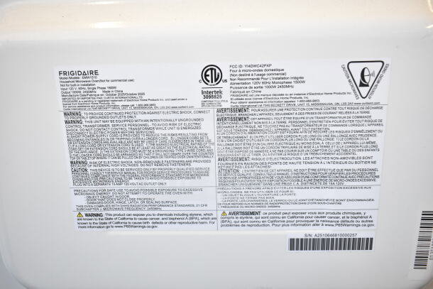 Frigidaire EMW1510 Countertop Microwave Oven label, showing model details, 120V, 1 phase, and safety warnings in English and French.