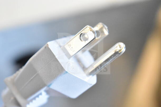 Detail of electrical plug from a 2019 Amana RCS10TS commercial countertop microwave oven, 120 volts, 1 phase.