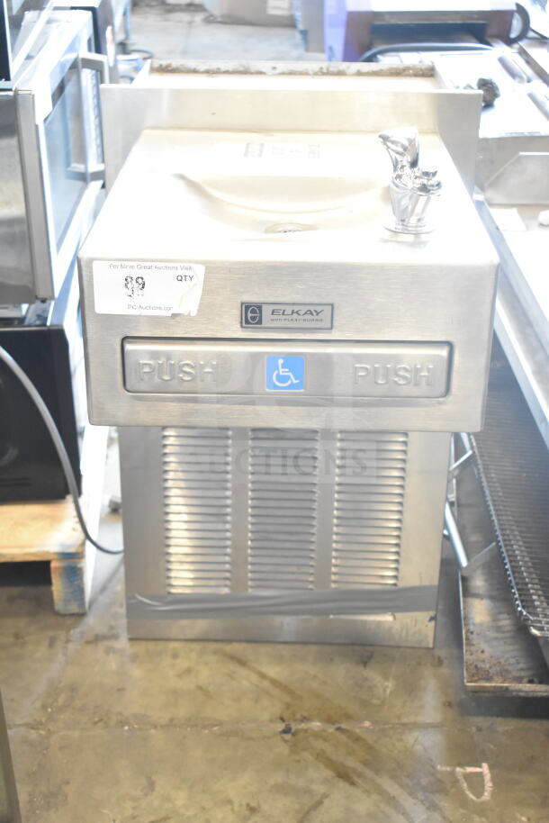 Elkay wall mount water fountain, stainless steel, used condition. Features Flexi-Guard bubbler, wheelchair accessible push pads.