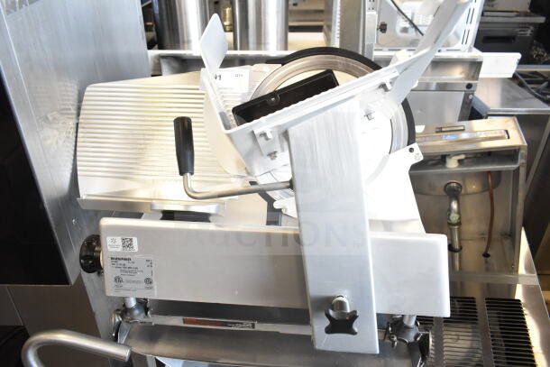 Bizerba GSP V commercial meat slicer on stand, 120V, 1 phase, excellent condition. Label shows model and certification details.