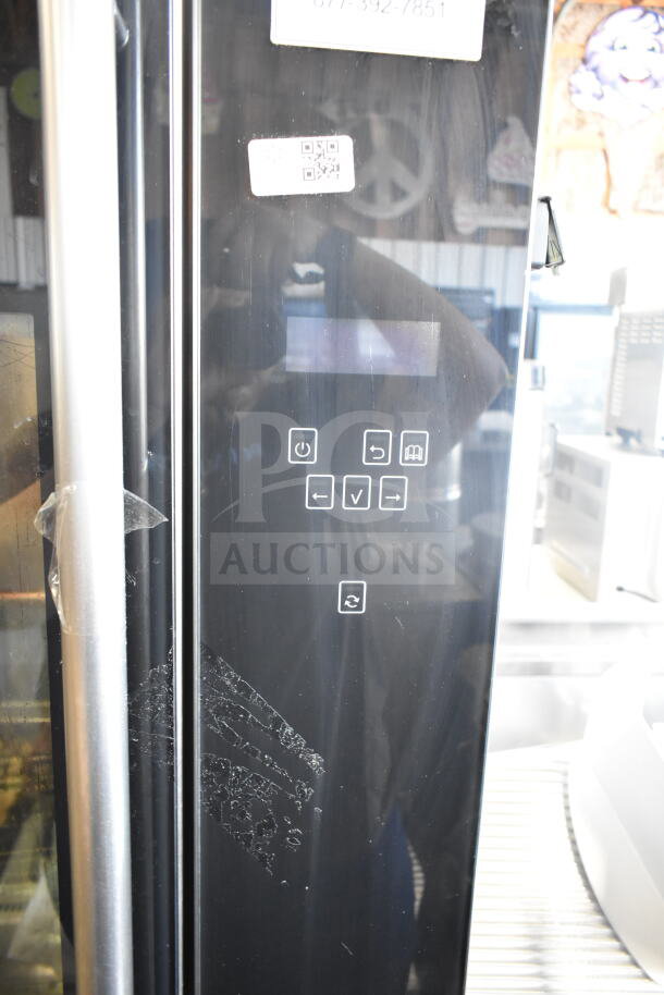 Fri-jado TDR 7-P stainless steel rotisserie oven with digital controls, visible signage, on commercial casters.