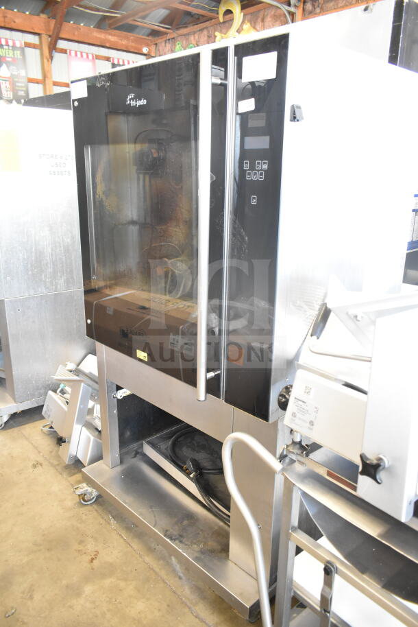 Fri-jado TDR 7-P stainless steel electric rotisserie oven, floor style, on casters, 208V, 3 phase, glass door, used condition.