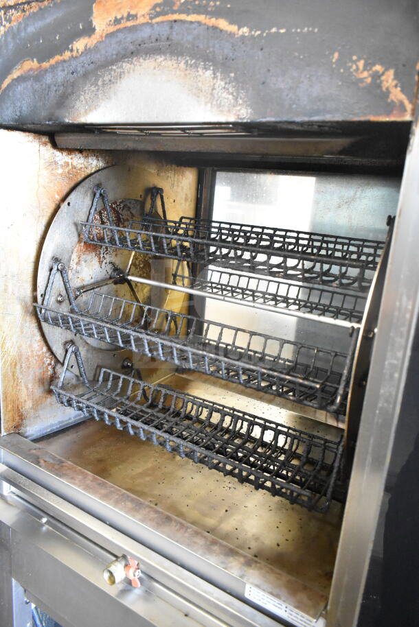 Fri-jado TDR 7-P stainless steel rotisserie oven on casters, used condition, 208V, 3-phase, interior racks visible.