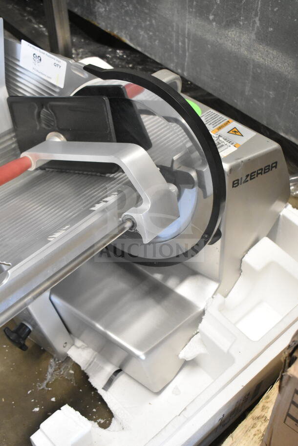 2016 Bizerba GSP H commercial countertop meat slicer, silver finish, model GSP H, 120 volts, showcasing blade and safety guard.