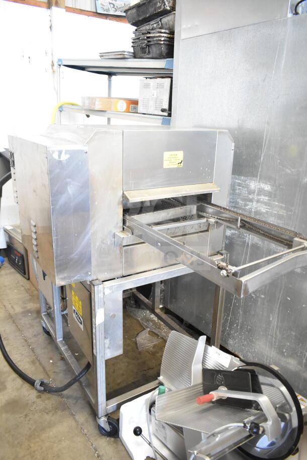 Belshaw TG50 Commercial Thermoglazing Station on casters, 208V, 1 phase, stainless steel, used condition.