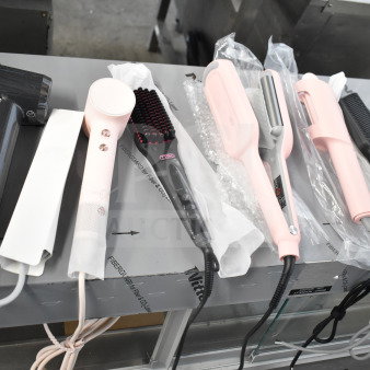 Six hair styling tools, including hair dryers and brushes, all with cut power cords; various colors and models displayed.
