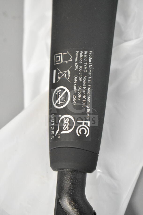 Product label on a hair straightening brush, Brand: TNIO, Model: HC1015, Voltage: 100-240V, Power: 62W. All cords cut.