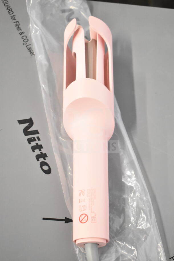 Pink hair dryer with a cut power cord, featuring open barrel design and brand markings. Part of a 6-item lot.