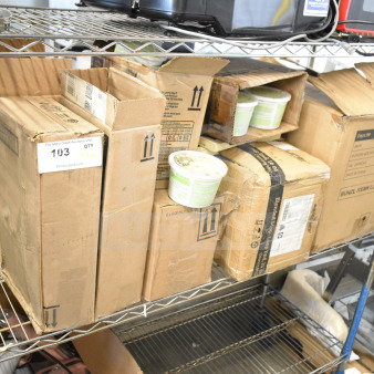Boxes on metal shelves containing Ecolab foam hand soap and Diversey floor cleaners. Includes shipping labels and product tags.