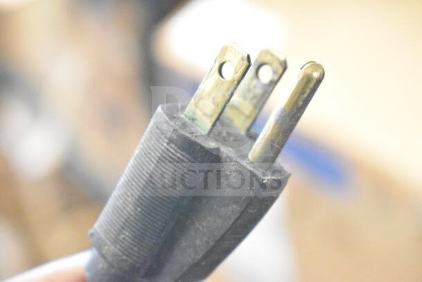 Close-up of a three-prong plug compatible with the 2017 Hobart HTi-7LH26 Commercial Countertop Food Portioning Scale.
