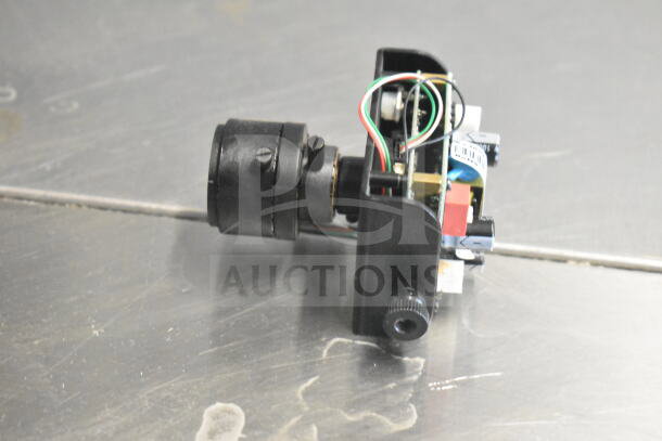 Box of Wren Cameras featuring multiple components. Lens and wiring visible, appears in fair condition. Ideal for parts.