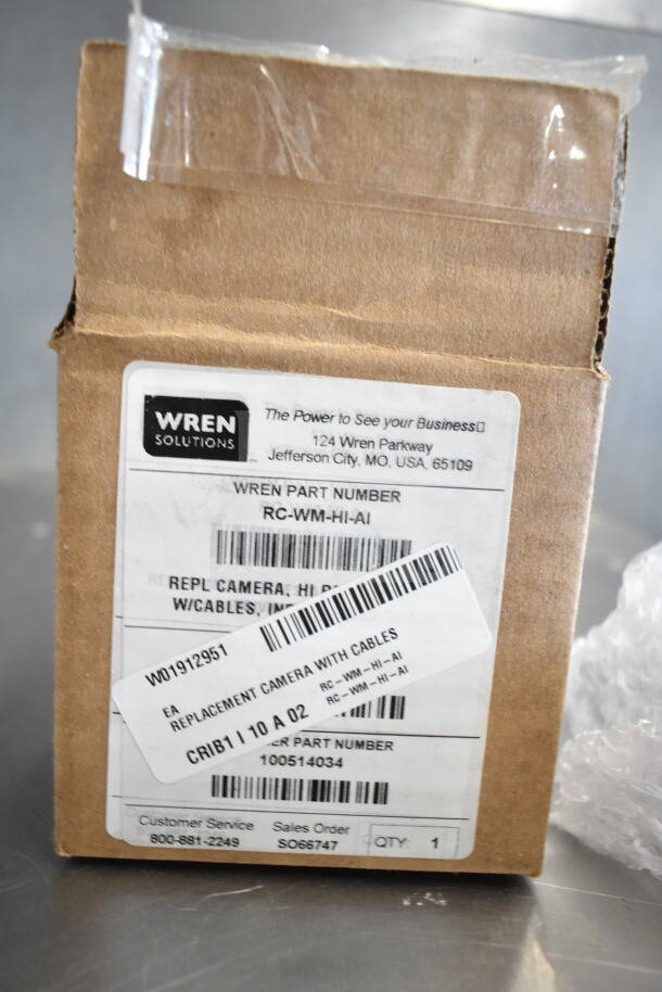 Box labeled "Wren Cameras" with part number RC-WM-HI-AI, includes replacement camera with cables, new condition.