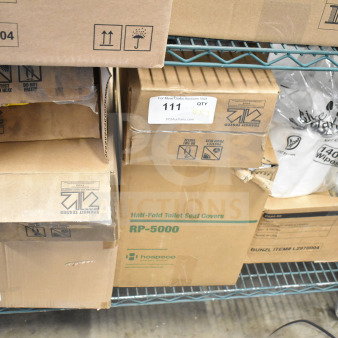 7 brand new scratch and dent items, includes RP-5000 toilet seat covers, Diversey cleaners. Boxes show signs of wear.