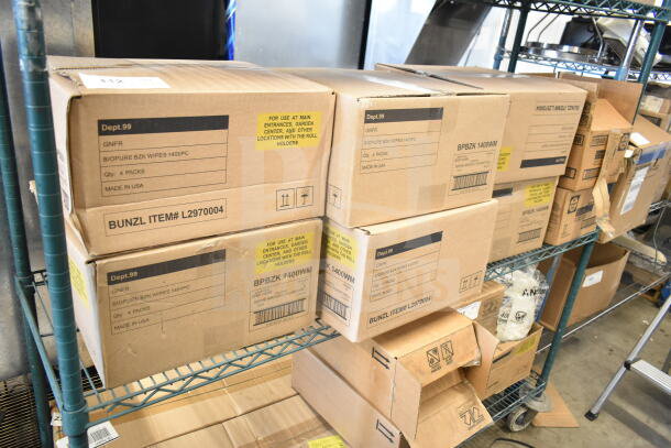 Boxes of GNFR Biopure BZK Wipes, 1400 pieces per pack, non-corrosive lime scale remover, on a metal shelf.