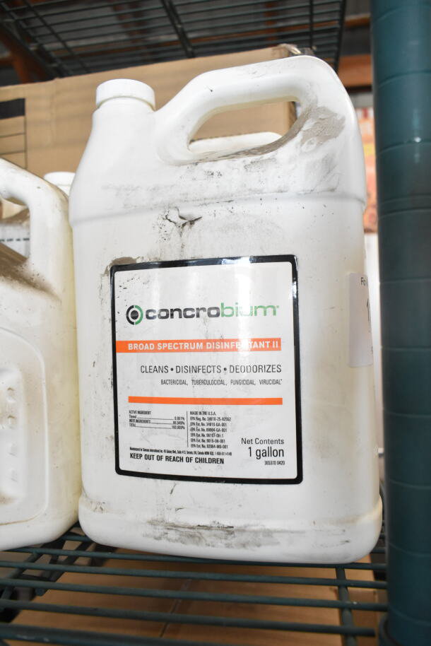 White Concrobium Broad Spectrum Disinfectant II gallon jug, slight scratches and dirt, labeled for cleaning, disinfecting, and deodorizing.