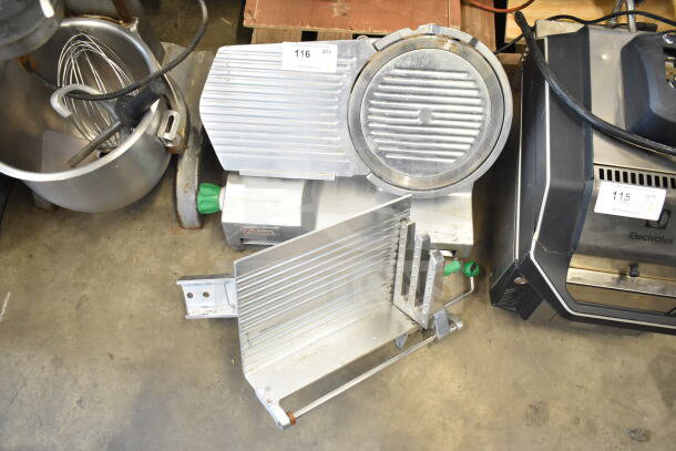 Primo Commercial Countertop Meat Slicer, missing arm, 115 volts, 1 phase. Visible use and wear. Auction tag attached.