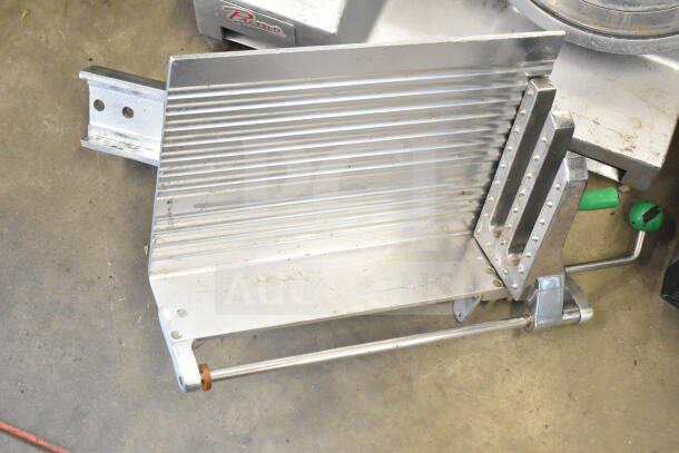 Primo commercial countertop meat slicer on floor, missing arm, visible Primo logo, designed for 115 volts, 1 phase.
