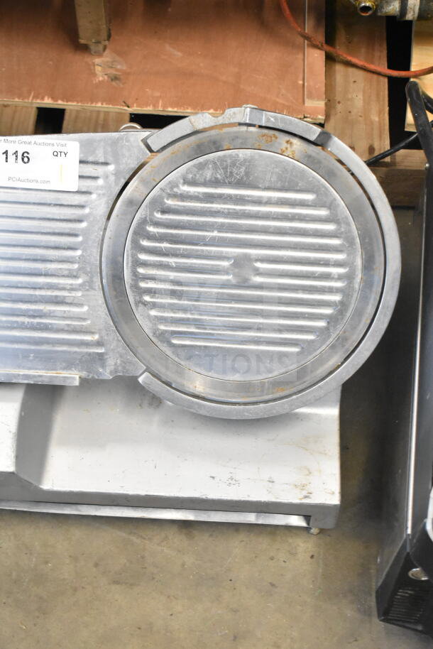 Primo commercial countertop meat slicer, 115V, 1 phase, missing arm, visible wear and rust, auction tag attached.