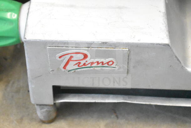 Primo commercial countertop meat slicer, 115 volts, 1 phase, missing arm, visible logo. Used condition.