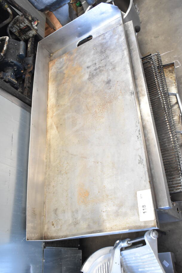 Commercial countertop flat top griddle with cheese melter, stainless steel, used condition, showing signs of rust and wear.