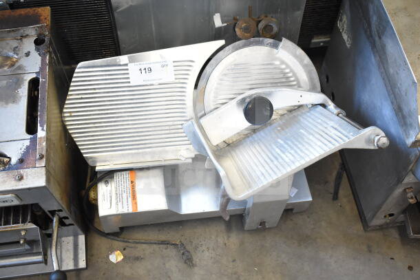 Fleetwood BF 300 meat slicer with blade sharpener, countertop model, 115V, 1-phase, commercial-grade, metal construction, includes warning label.