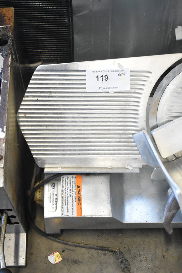 Fleetwood BF 300 Commercial Meat Slicer with blade sharpener, 115V, 1 phase, aluminum body, used condition, tag visible.